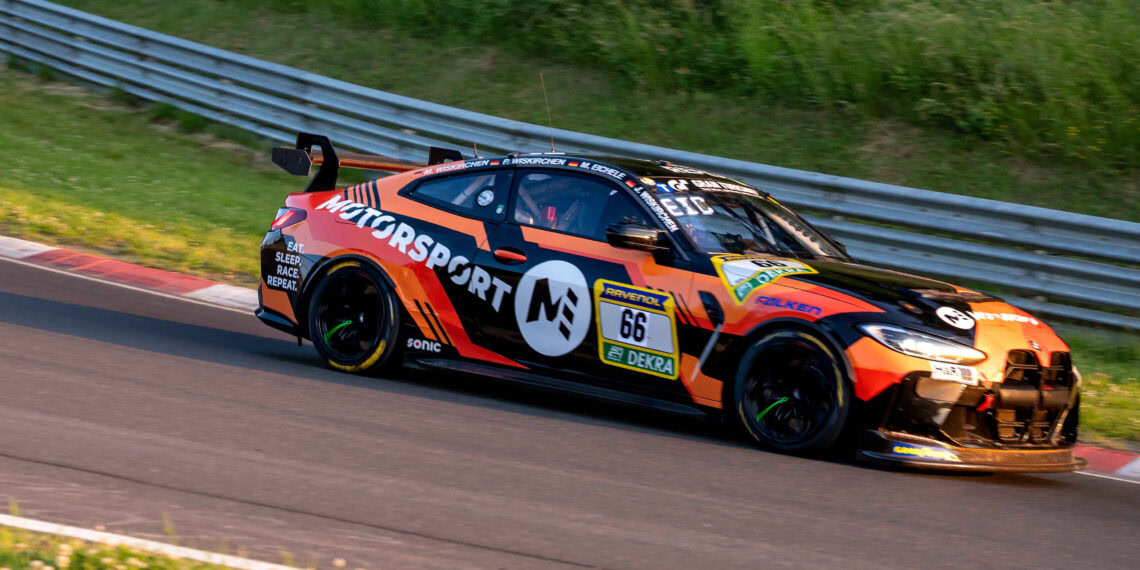 Bmw m4 gt3 race car on track at nürburgring.
